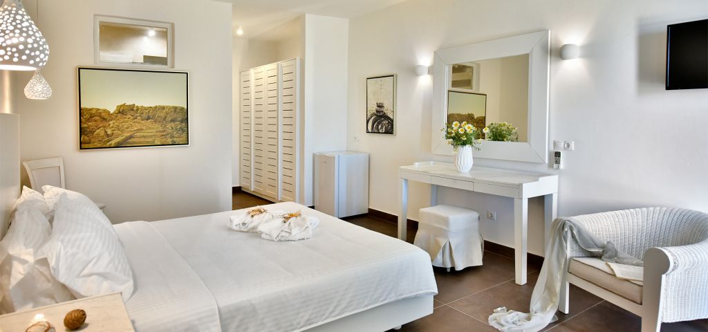 The Double Room at Jenny`s Summer Houses Mykonos decorated in white color.