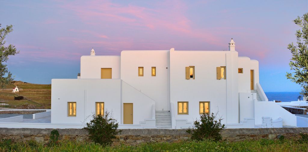 Jenny`s Summer Houses property in Platys Gialos outdoor overview during sunset.